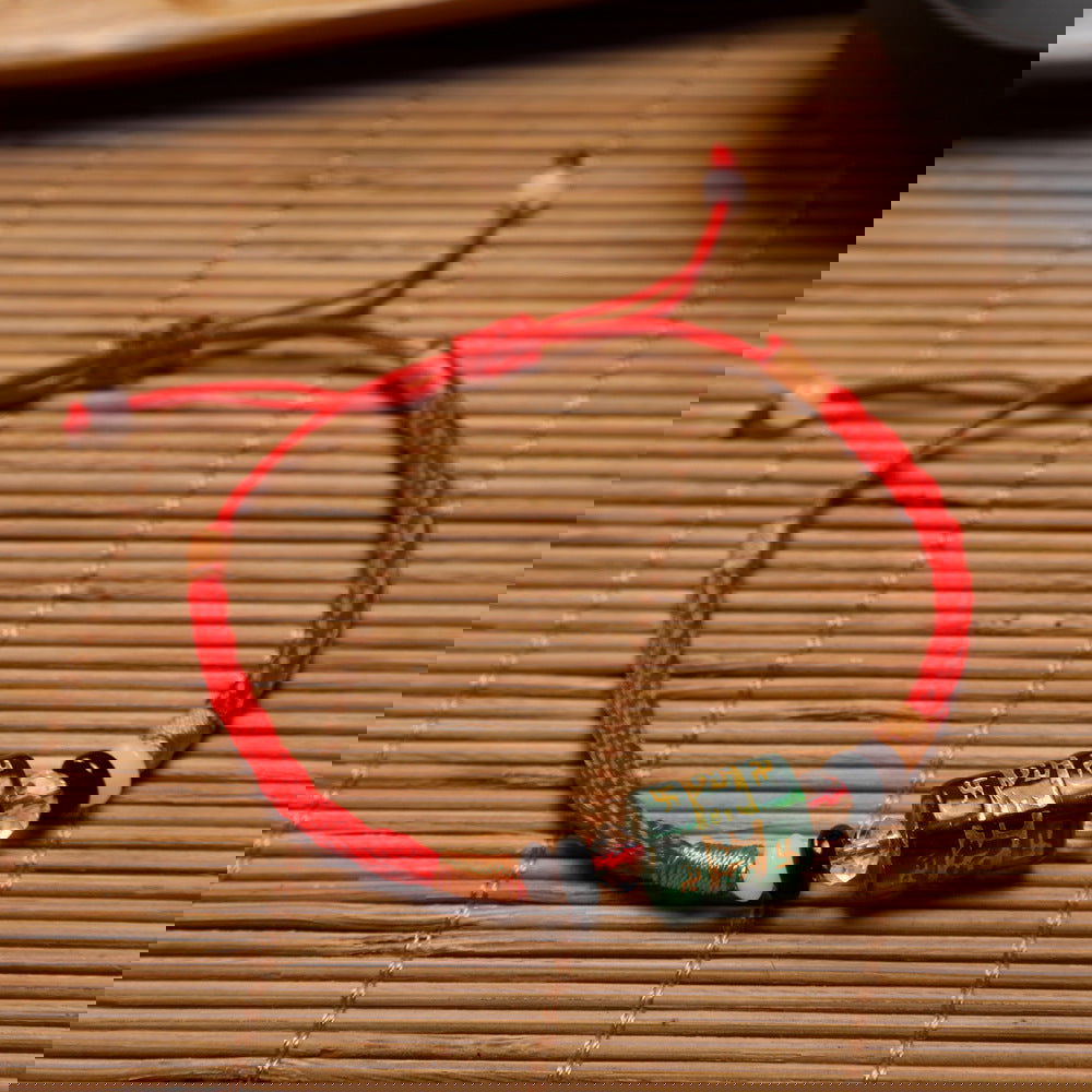 Red string bracelet with six-syllable mantra for the zodiac year - Oriental Buddha Karma  -  - 